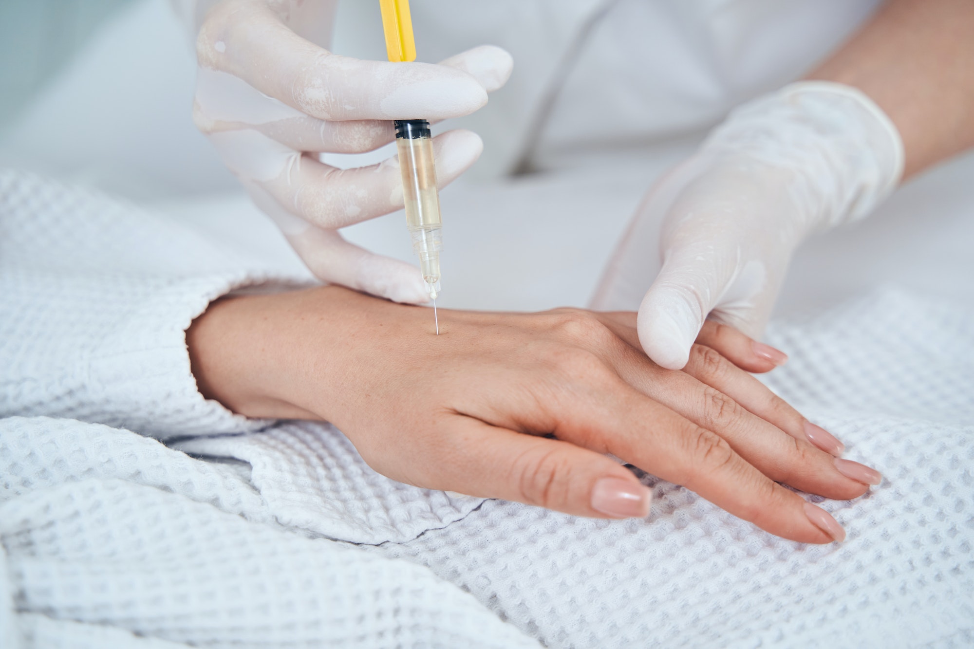 Kind female person doing professional skincare procedure